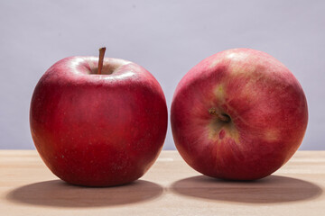 Red apples on a wooden table