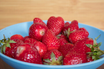 Bowl fill with strawberries.