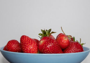Bowl fill with strawberries.