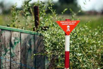 War in Ukraine mined destroyed village Kamyanka. Izyum district summer 2025. mines danger sign