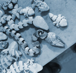Art objects printed on a 3D printer. Various creative models created on a 3D printer from molten...