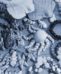 Art objects printed on a 3D printer. Various creative models created on a 3D printer from molten...