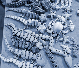 Art objects printed on a 3D printer. Various creative models created on a 3D printer from molten...