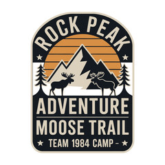 Retro vintage camping emblem with mountain peak, moose silhouettes, and adventure text in earthy tones