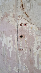 Raw plug holes in a wall