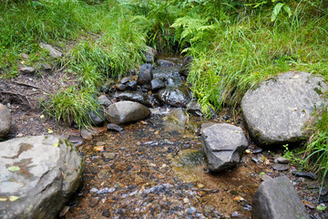 Small river flowing over granite rocks