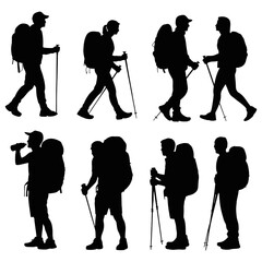 Silhouettes of hikers with backpacks and walking sticks
