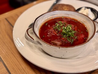 Soup vegetables red borscht on table. First course vegetable dish fresh delicious gourmet food background on the table rustic food vegetarian and vegan food. Close-up
