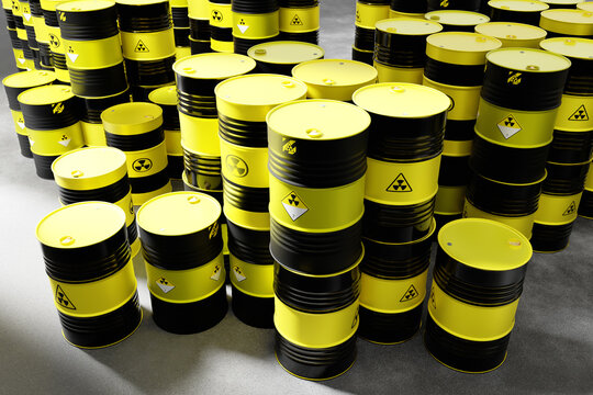 Numerous black and yellow radioactive barrels with hazard symbols stored indoors, used for containment of nuclear waste and hazardous materials – Waste management. 3d image