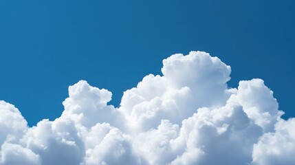 Fluffy clouds against blue sky