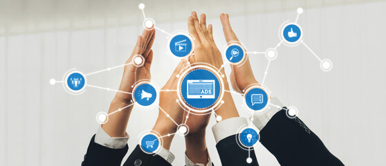 Hands coming together symbolize collaboration in advertising, showcasing innovative strategies for...