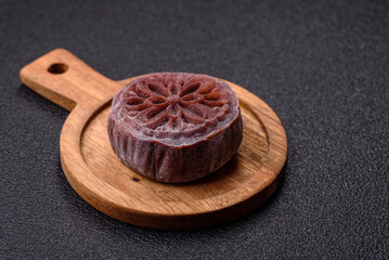 Chinese mooncake is an Asian sweet dessert. Asian mooncake as a background for your design