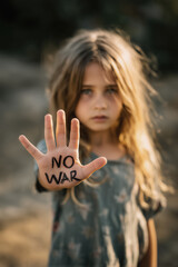 Young girl - No war written on her hand