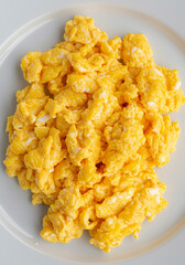 Scrambled eggs on a white plate