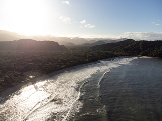 Incredible sun rising between the mountains on a beach on the north coast of São Paulo