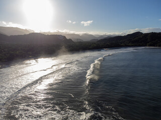 Incredible sun rising between the mountains on a beach on the north coast of São Paulo