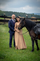 young couple with horse