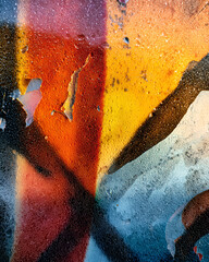 Sun warped laminated sign with abstract vibrant colors and textures