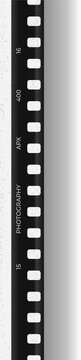 Fototapeta Presenting 35mm film strip on transparent background, featuring sprocket holes and film markings