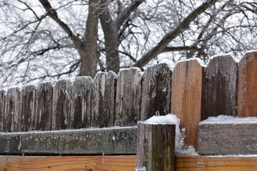 Fototapeta premium Wooden fence in winter