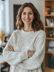 Portrait of a female clinical psychologist standing warmly in a counseling office, smiling
