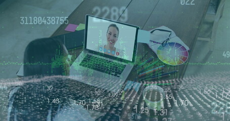 Analyzing data with colleague wearing light blouse on laptop at studio, color wheel, data overlay