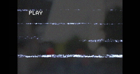 Displaying PLAY overlay text over glitchy static interference lines on screen interface