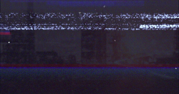 Flickering glitchy analog static filling vintage TV screen, showing red and blue glitch lines