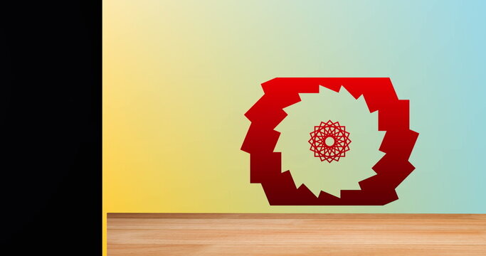 Fototapeta Displaying red jagged-ring artwork with mandala on gradient wall, with wood floor, black panel