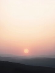 Pastel sunset over a hazy, flat landscape.