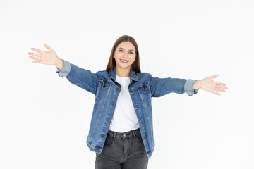 Portrait of a happy young girl with outstretched hands to embrace you isolated on a white background. Woman wants to hug you.