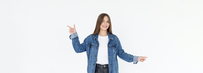 Image of beautiful woman pointing fingers left and right, making decision, showing two variants choices, standing over white background