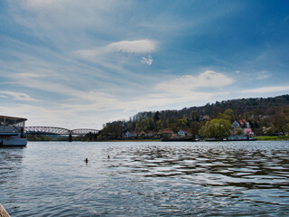 Obraz premium Gorgeous view of the River Weser in Germany with the city of Hameln visible in the back
