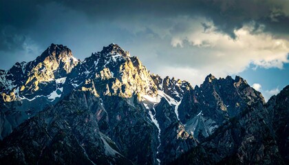 Majestic Mountain Range During Sunset Under a Dramatic Sky