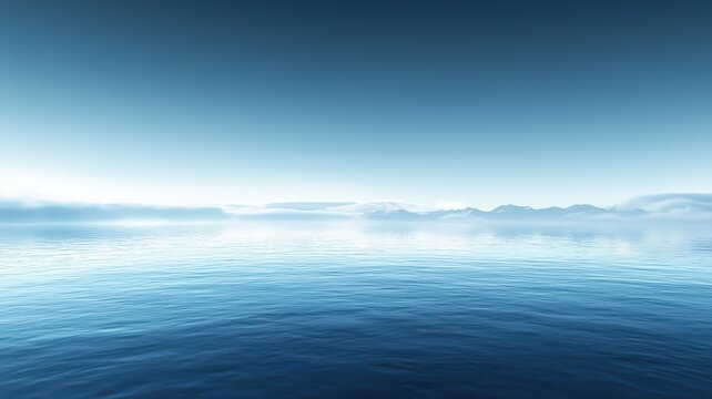 Embrace of Calm: Ocean Stillness Under a Blue Sky with Misty Mountains on the Horizon