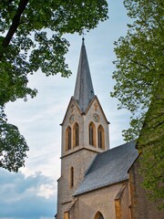 Old church tower with a clock from below
