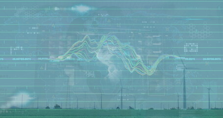 Showing wind turbines spinning on green grass field, displaying grid lines and numeric overlays