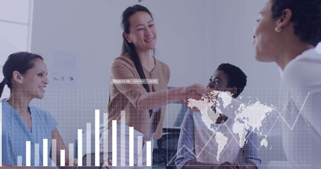 Shaking Asian professional extending hand to seated colleague in conference room, with data overlay