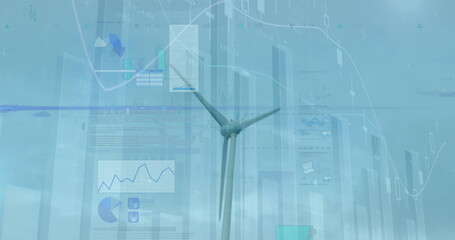 Standing wind turbine displaying chart overlays over coastal horizon, with financial data panels