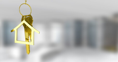 Hanging gold house-shaped keychain with metal keys on ring in modern living room, copy space