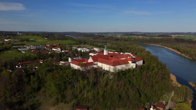 Aerial view Luftaufnahme of Attel Monastery and St. Michael Church on Attel Hill by Inn River, near Wasserburg am Inn, Bavaria. Historic Benedictine site, scenic spring landscape, rural Germany charm