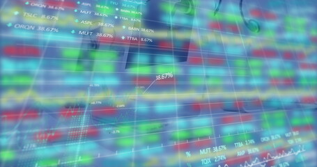 Displaying financial dashboard showing heat-map grid on screen, with tickers and percentages