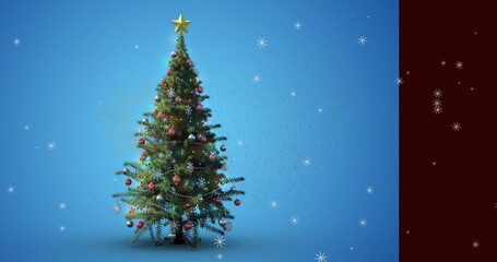 Showing artificial Christmas tree in studio with gold star topper, baubles, garlands and snowflakes