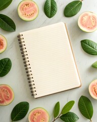 Captivating guava slices and fresh green leaves surrounding a notebook in a soft natural setting a serene composition for creative inspiration.