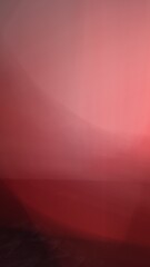 A striking blend of red and pink hues creates a seamless gradient with soft transitions. The vivid colors merge fluidly, forming a dynamic and visually captivating abstract composition.