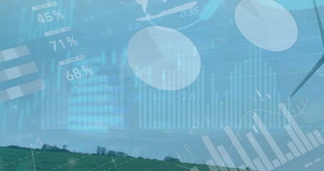 Overlaying semi-transparent graphs percentages and world map on rural hill, with wind turbine blade