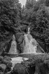 Triberg waterfalls (Triberger Wasserfälle) - Gutach river, one of Germany's highest waterfalls located in the Black Forest in black and white