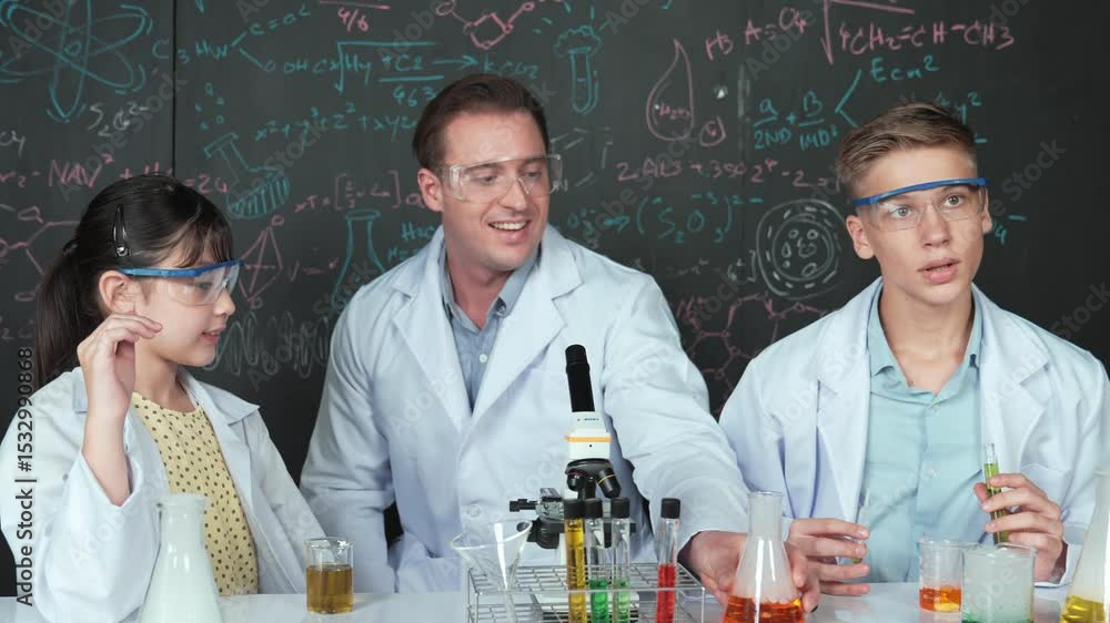 Poster smart girl inspect colored liquid while diverse student doing experiment in stem science class. grou
