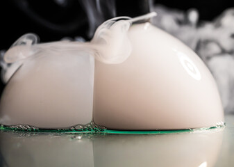White foggy vapor forming on smooth surface.