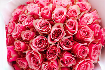 Pink 51 roses arranged beautifully in a bouquet for a special occasion in daylight